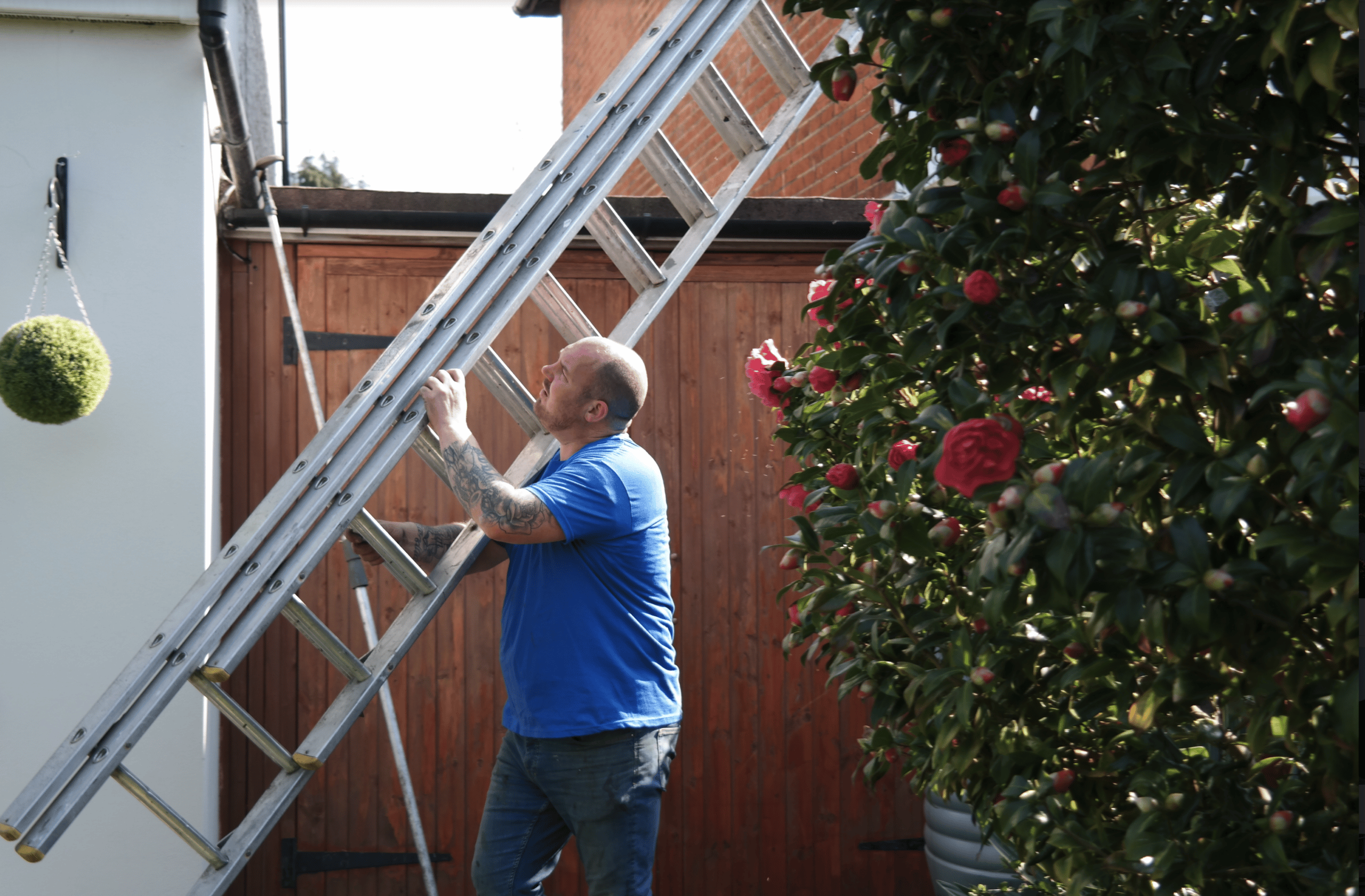 man carrying ladder