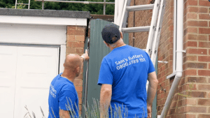 men installing gutter