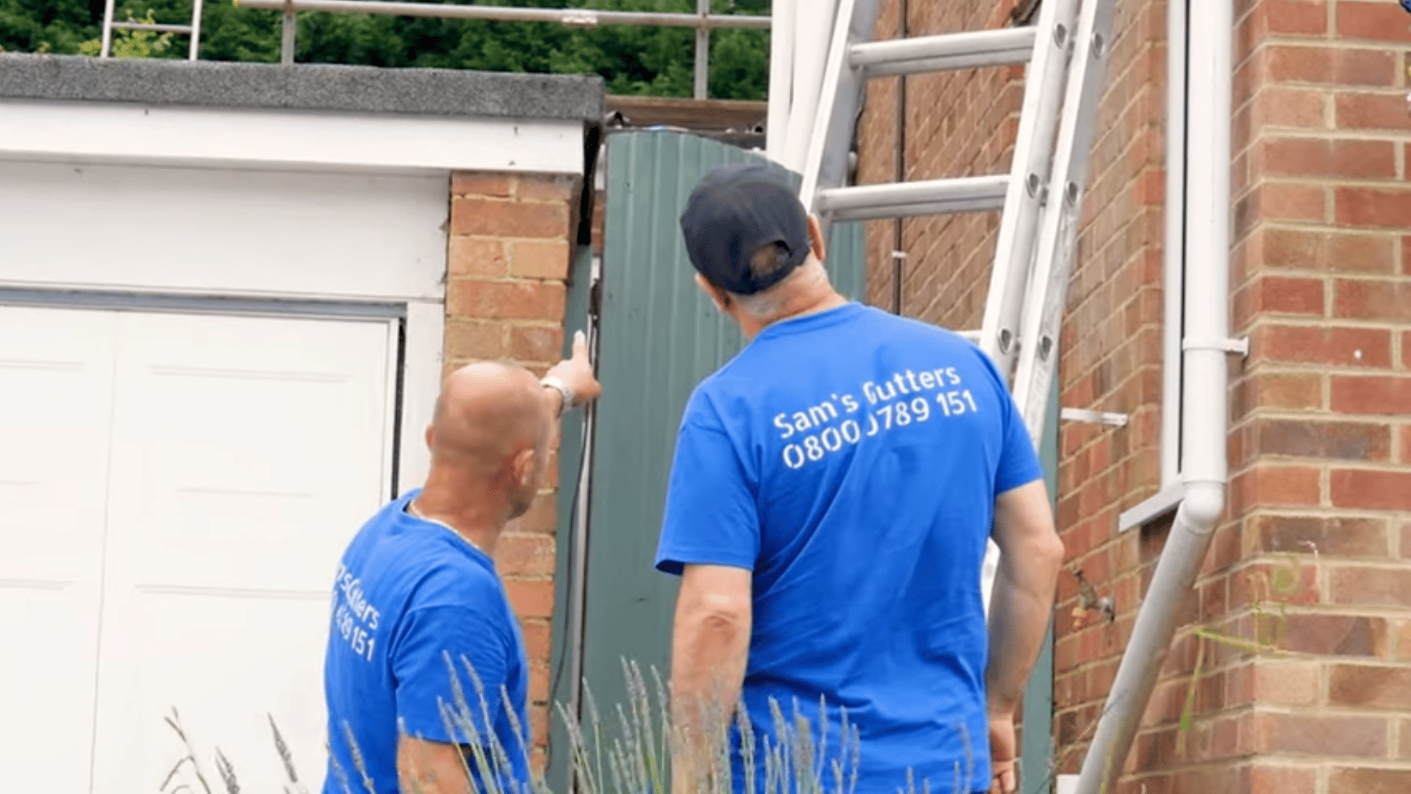 men installing gutter