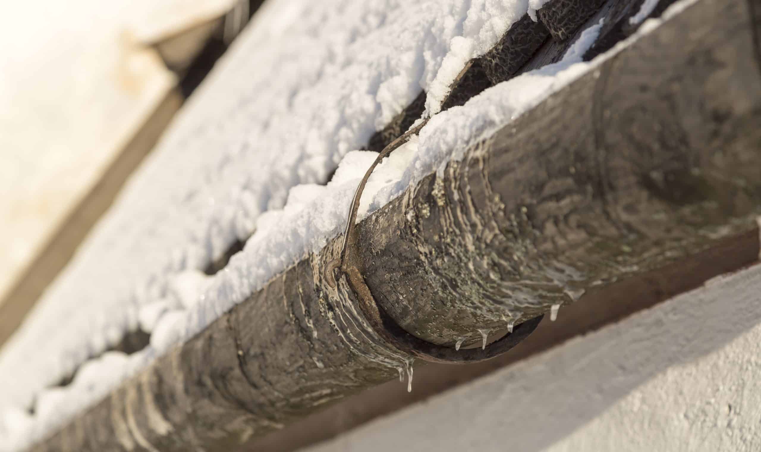 Old Gutter with Snow close up.