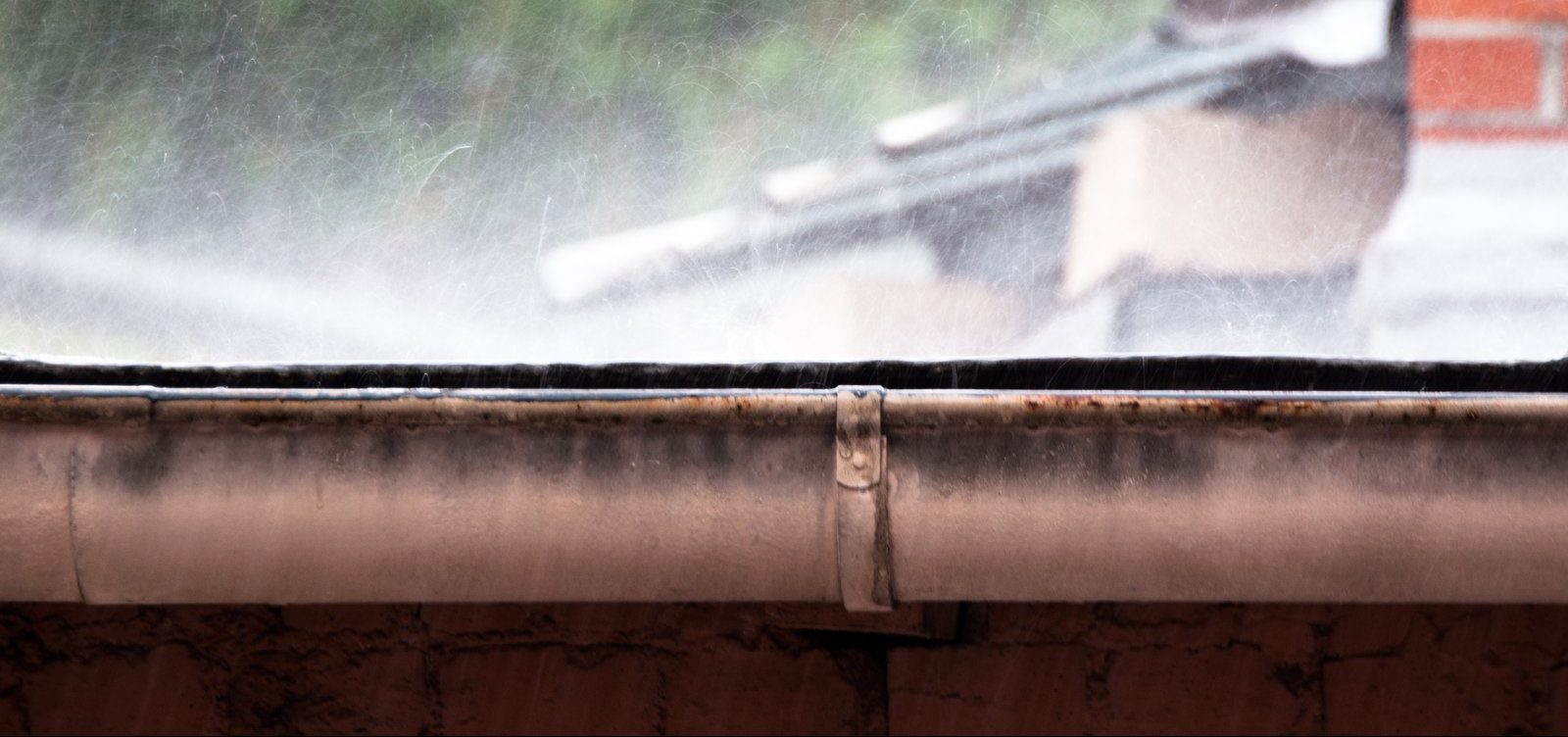Heavy rain hitting gutters