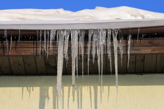 icicles hanging from gutters off roof