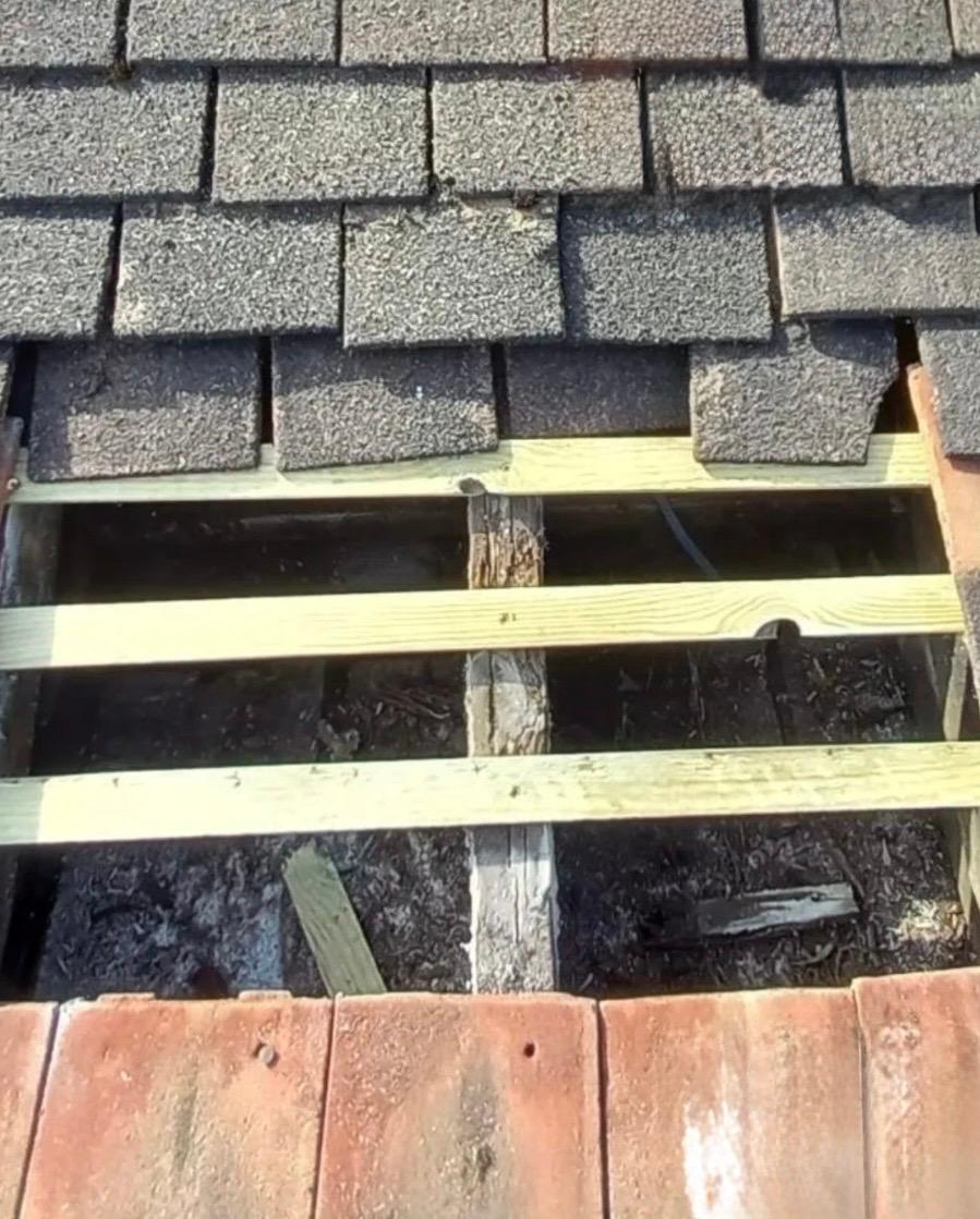 Grey roof tiles that have been removed.