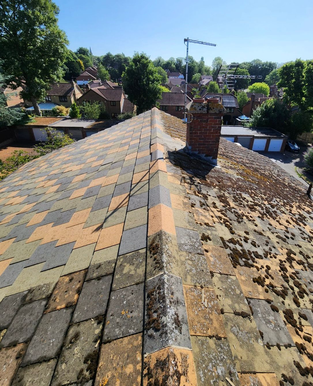 A roof that is half clean and half dirty.