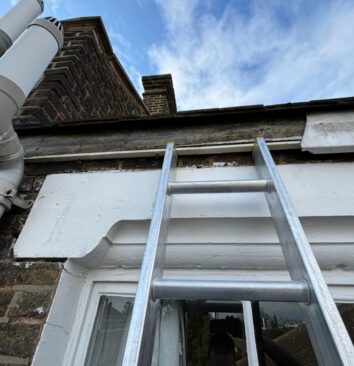 A missing white fascia board on a residential property.