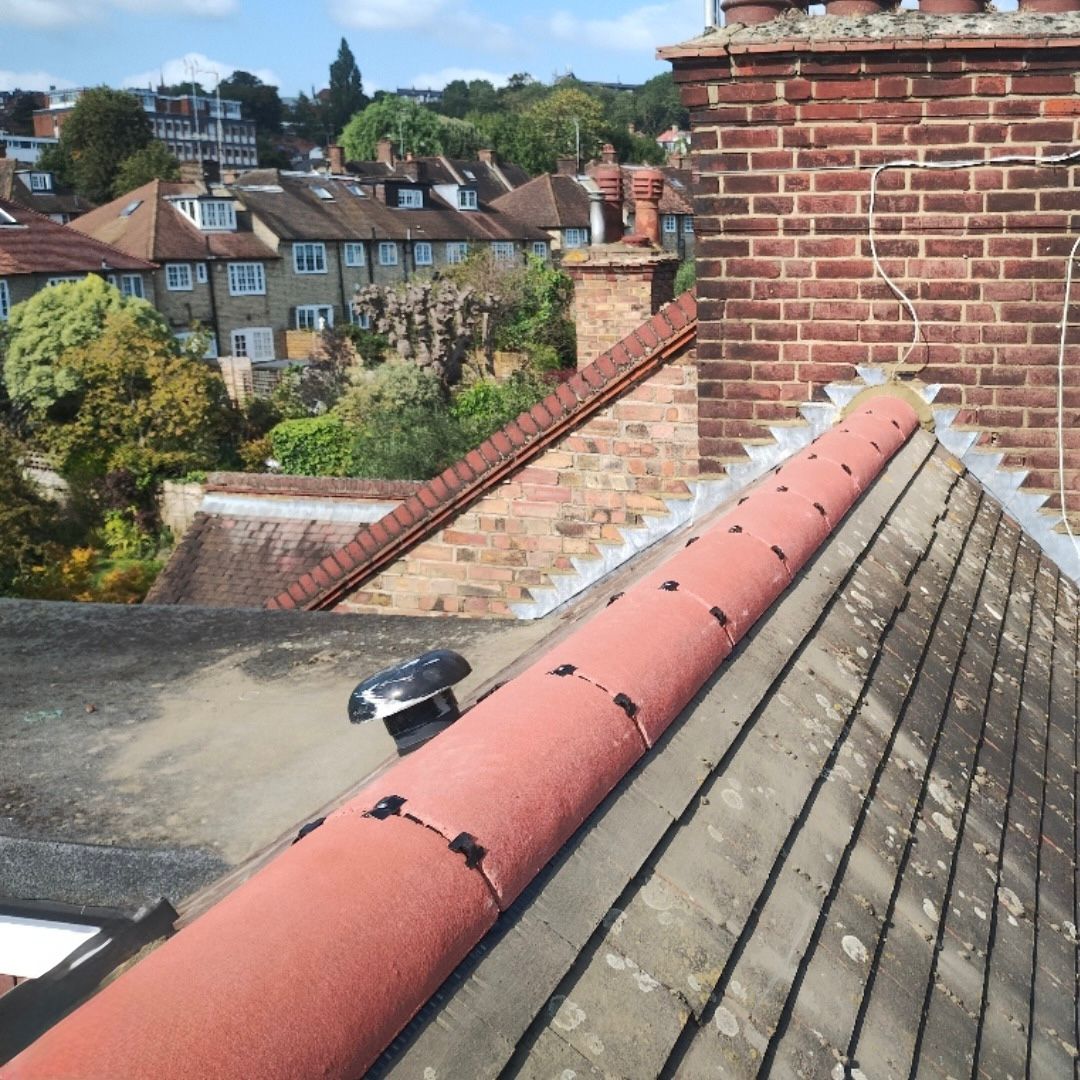 Newly installed ridge tiles on roof.