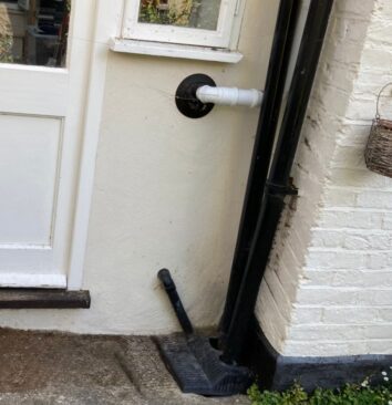The before image to show where a water butt will be installed.