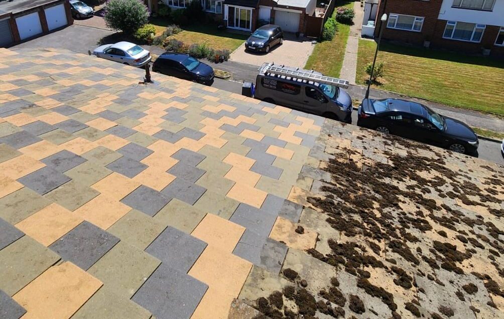 A roof that is half clean and half dirty.