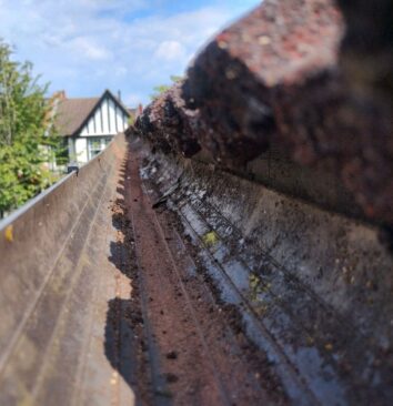 Showing the inside of a cleared gutter.
