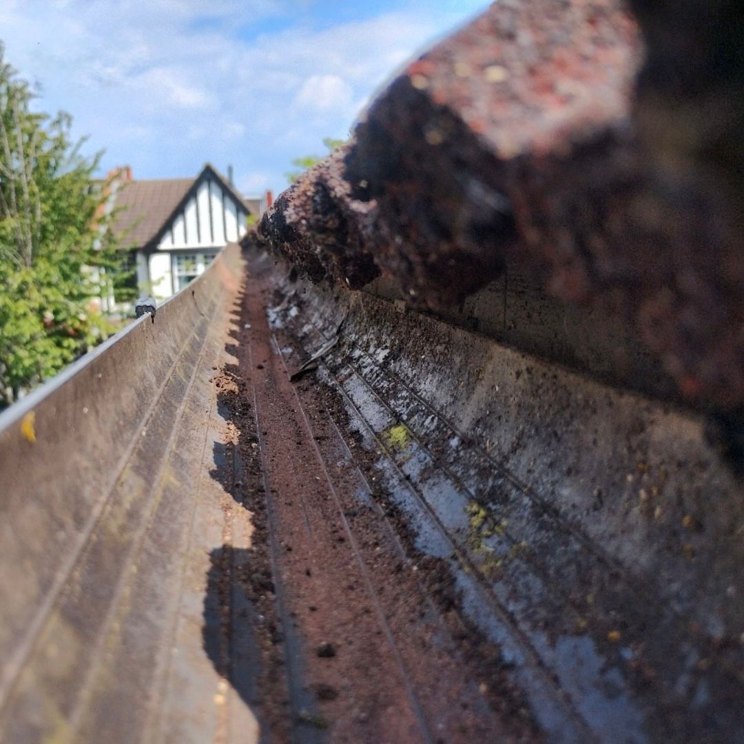 Showing the inside of a cleared gutter.