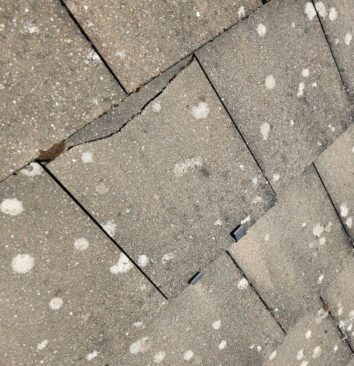 A small crack on a roof tile.