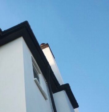 A newly installed black UPVC gutter.