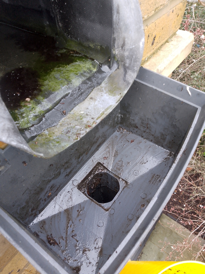 An after of a commercial downpipe that has been cleared.