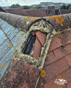 Damaged roof tile before.